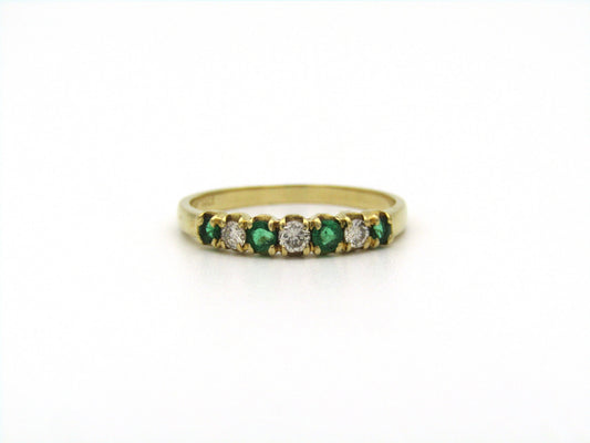 18K gold emerald and diamond ring.