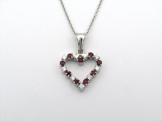 18K gold diamond and ruby heart pendant.