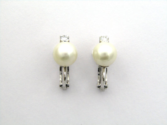 18K gold cultured pearl and diamond earrings.