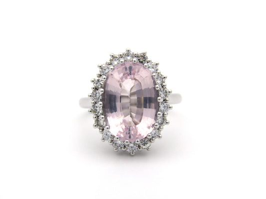 18K gold morganite and diamond halo ring.