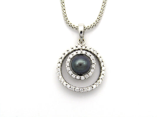 18K gold Tahitian pearl and diamond pendant.