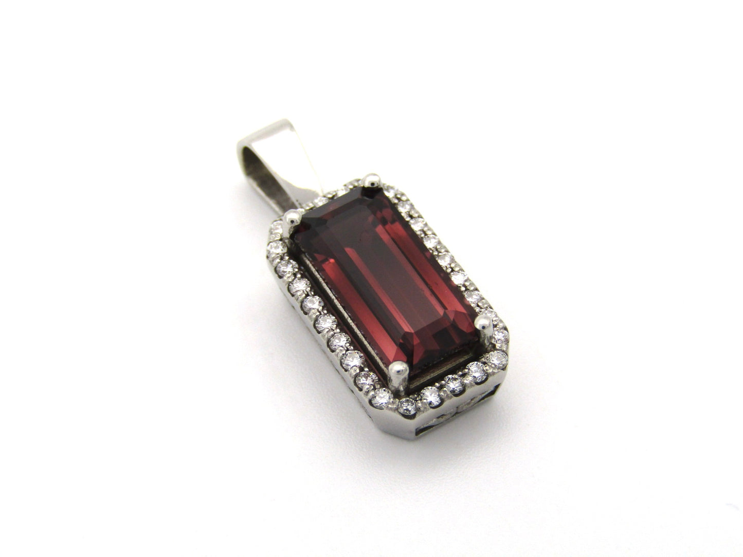 9K gold red tourmaline and diamond pendant.