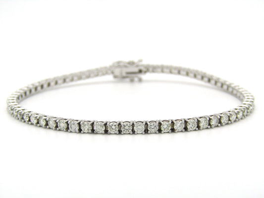 18K gold diamond tennis bracelet.