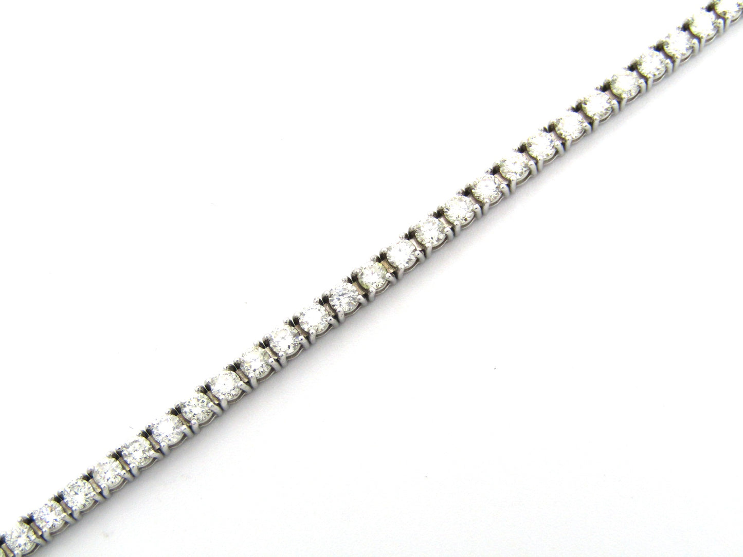 18K gold diamond tennis bracelet.