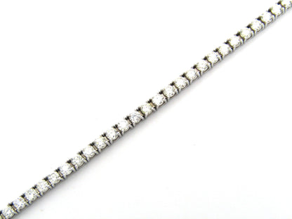 18K gold diamond tennis bracelet.