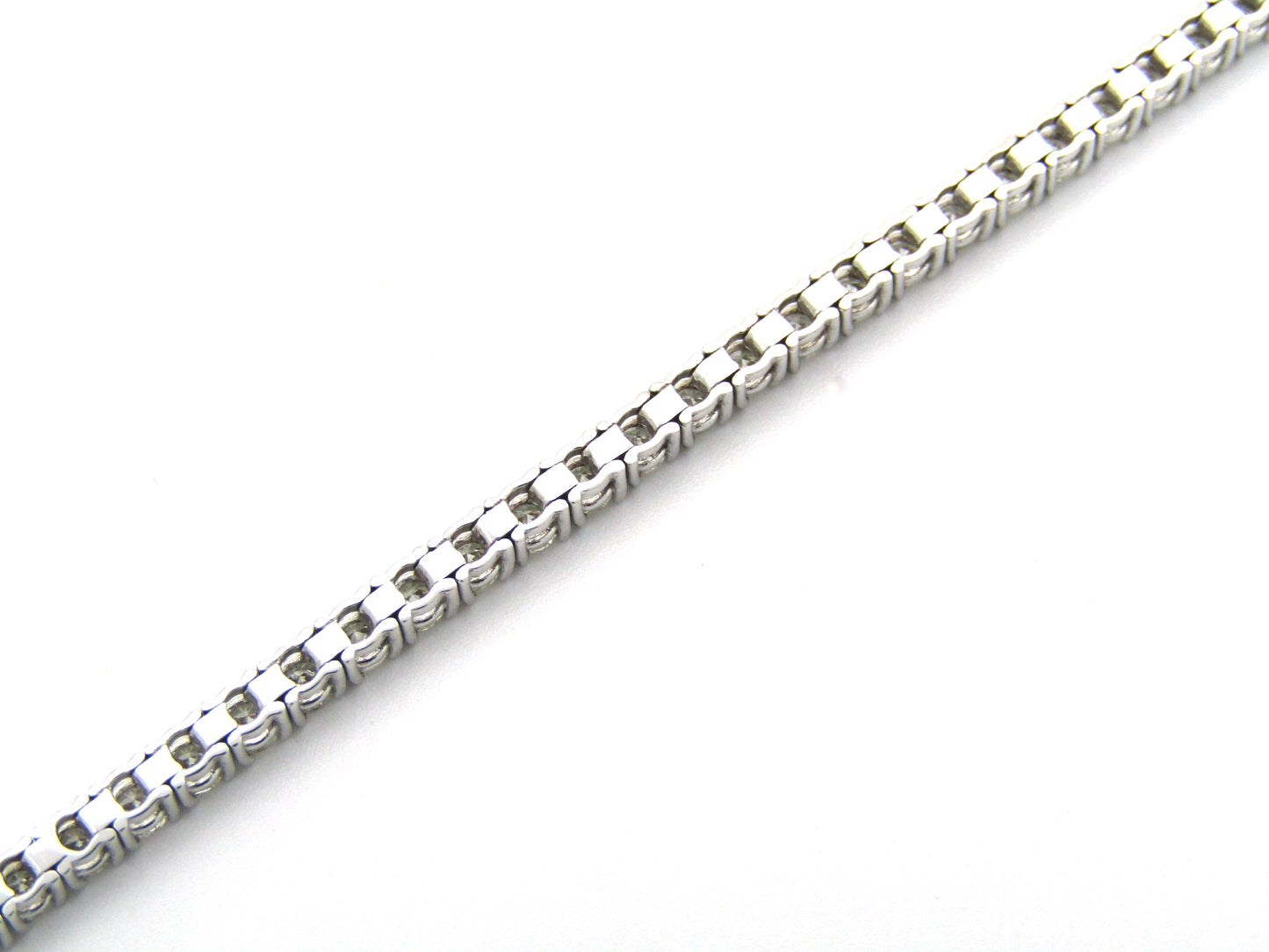 18K gold diamond tennis bracelet.