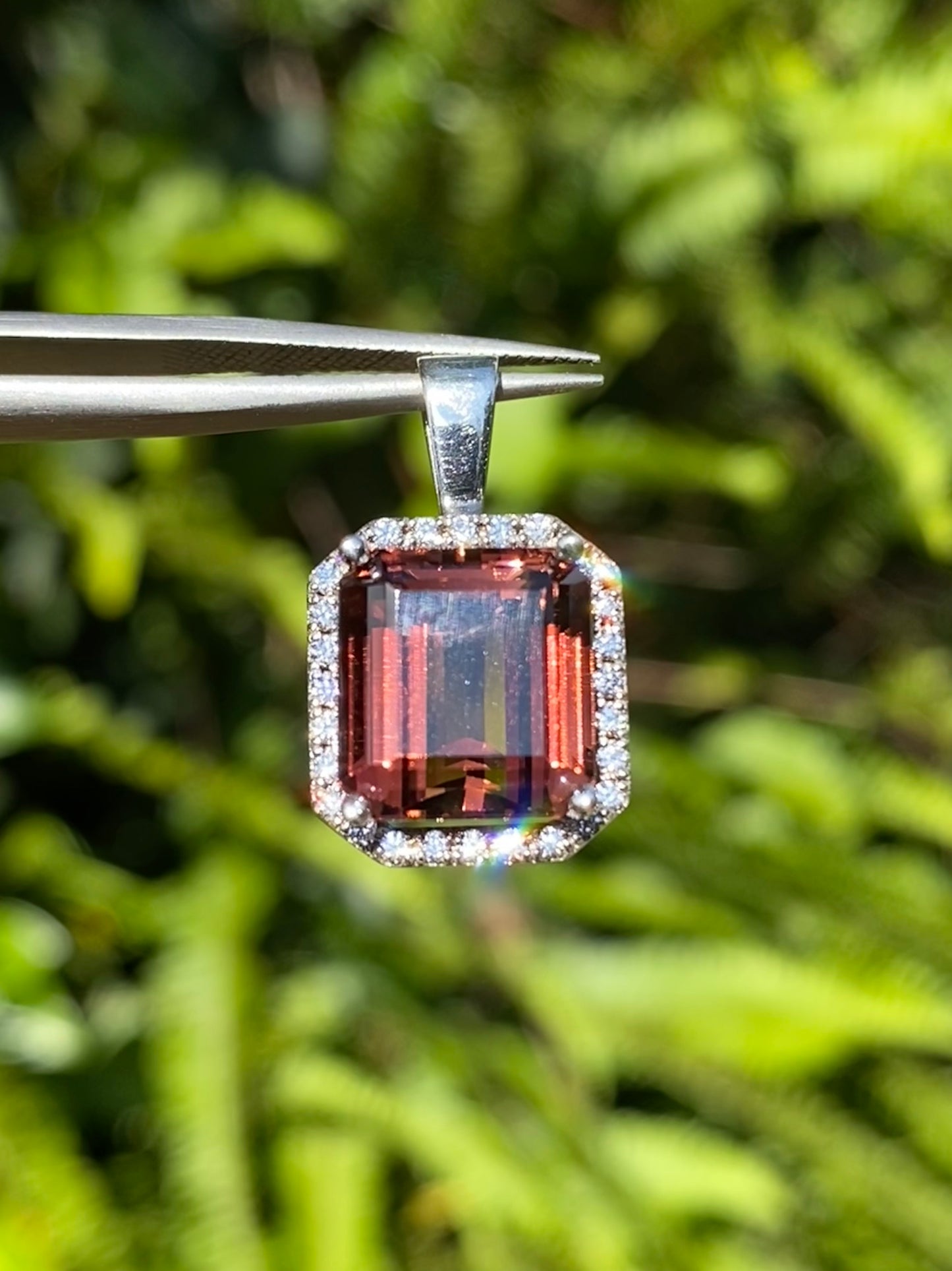 9K gold orange tourmaline and diamond ring.